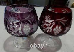 Two NACHTMANN TRAUBE AMETHYST AND RUBY RED CUT TO CLEAR BRANDY SNIFTERS